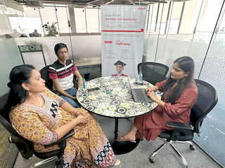 upGrad Indore Office - student and parents with the counselling team after their study abroad session